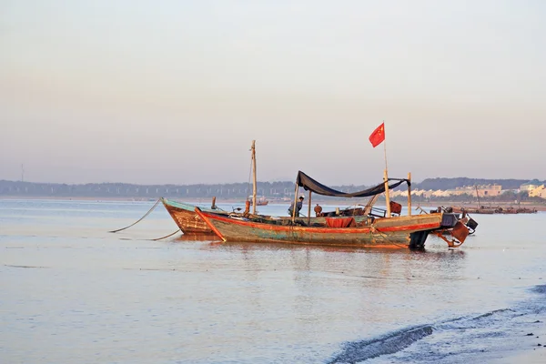 Morning on the yellow sea. Fishing boats are at sea. — Stock Photo, Image
