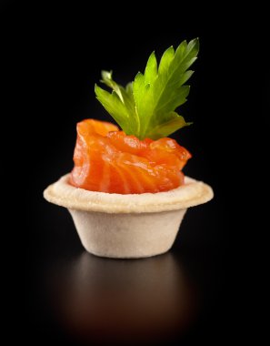 Сloseup of canape with smoked salmon fish clipart