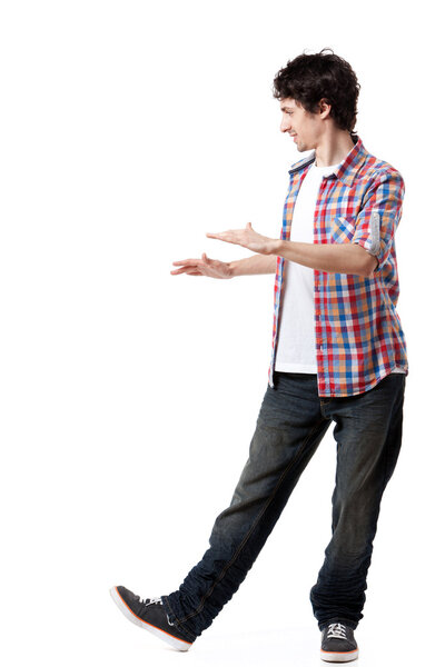 Young man in casual clothes posing over white background.