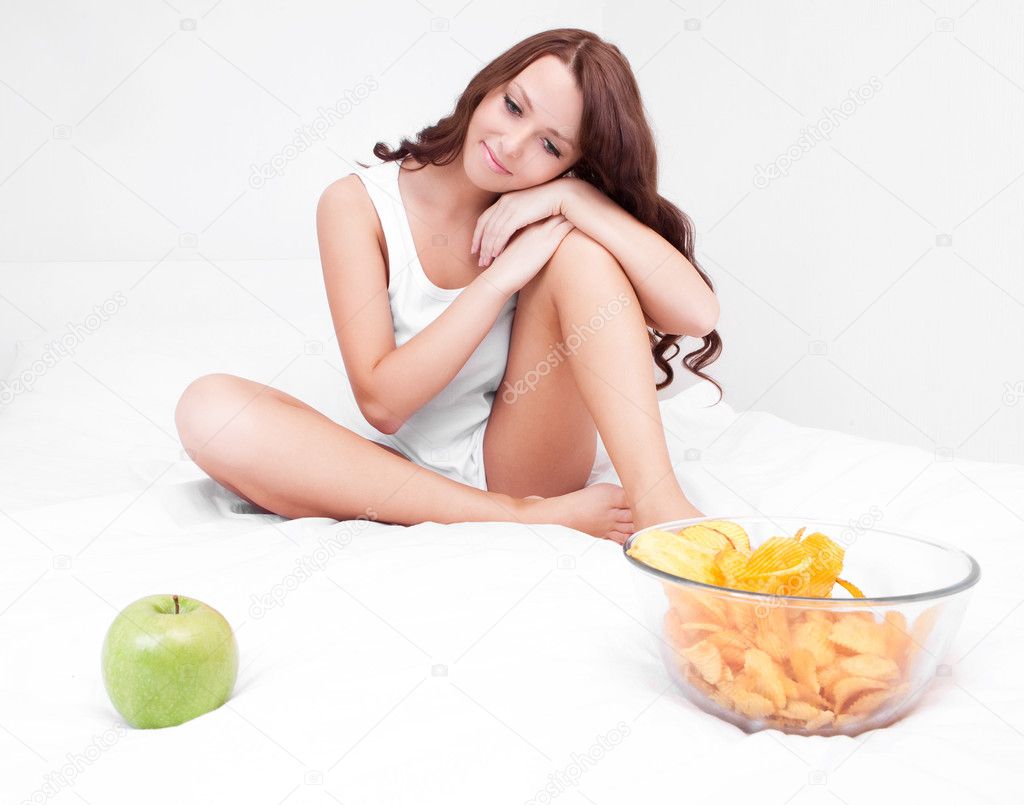 Woman with apple and chips