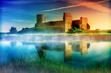 Old castle ruins at magical sunset clipart