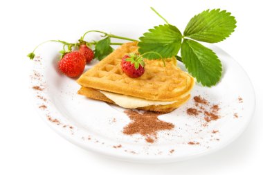 Plate of belgian waffles with fresh strawberries and whipped cream clipart