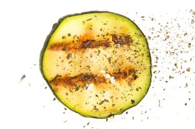 Grilled organic zucchini slices with herbs and spices clipart