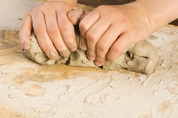 Child hands of a potter — Stock Photo, Image