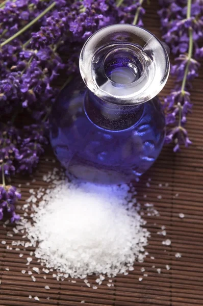 Lavender flowers with the bath salt and essential oil — Stock Photo, Image