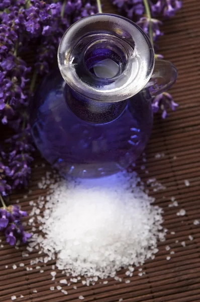 Lavender flowers and the bath salt and essential oil — Stock Photo, Image