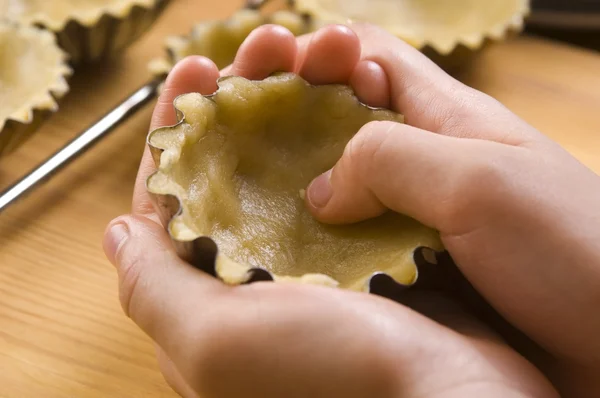 stock image Detail of child hands making cookies