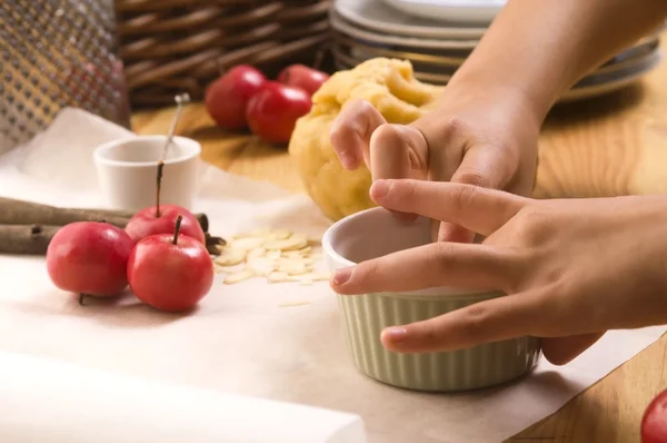 stock image Detail of child hands making apple pie