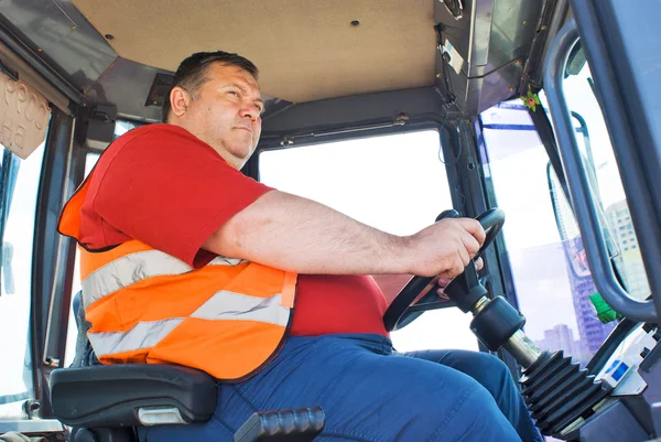 The driver working in the cabin of the truck — Stock Photo, Image