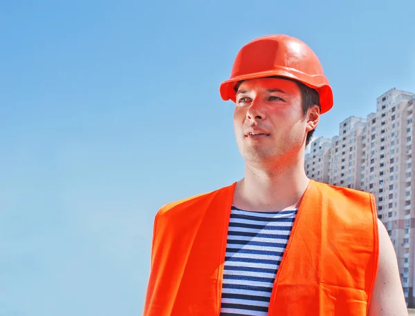 Builder worker in uniform and helmet — Stock Photo, Image