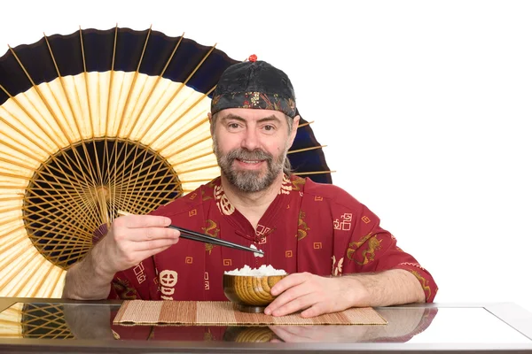 Europea en traje chino comer arroz — Foto de Stock