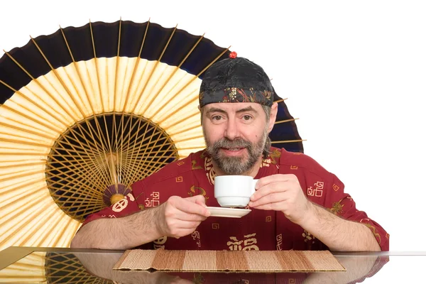 Europäer im chinesischen Anzug trinken Tee — Stockfoto