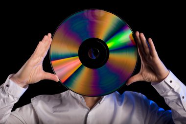 Man holds retro laser disc clipart