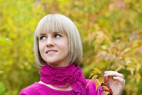 Girl holding a branch with leaves — Stock Photo, Image