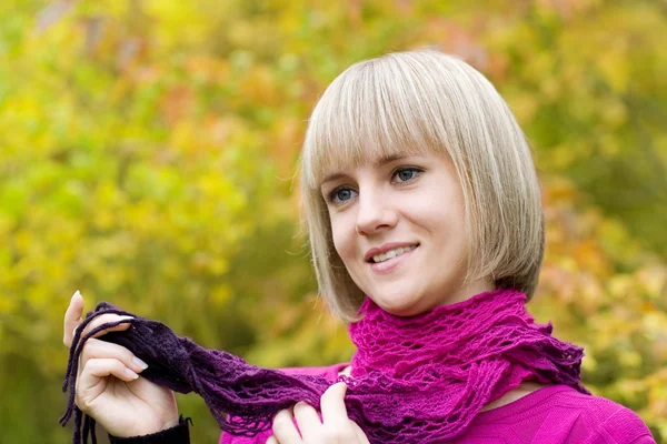 Thoughtful girl holds a scarf — Stock Photo, Image