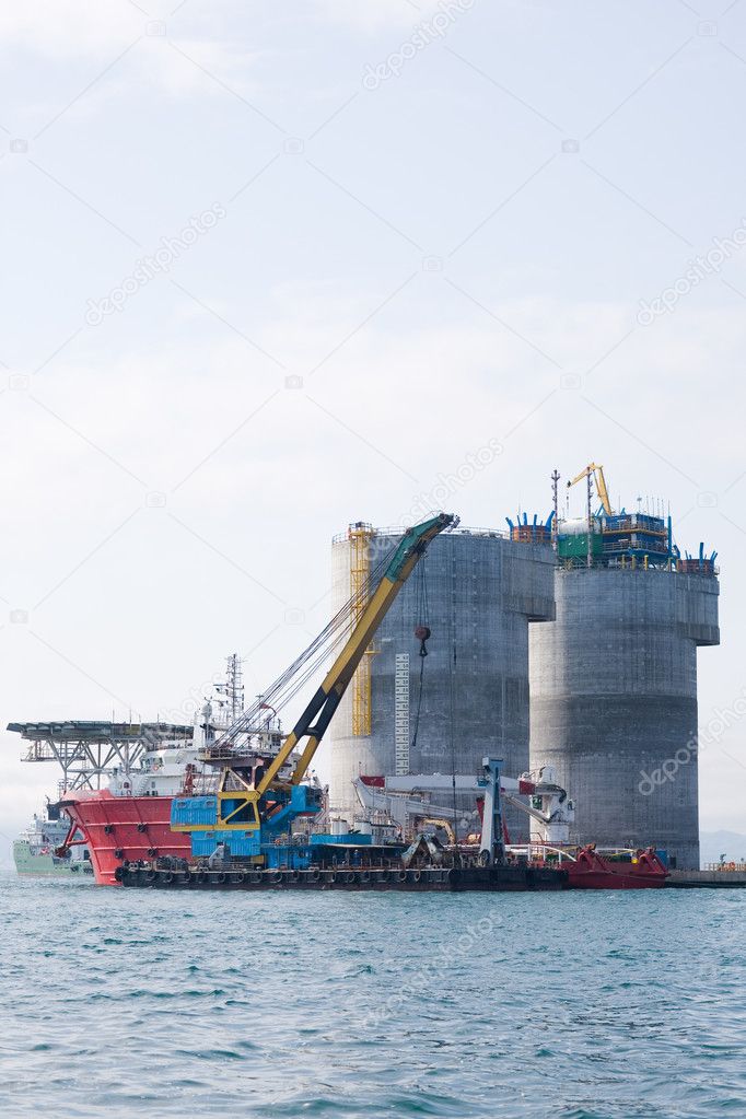 Floating crane and tugs of oil platform