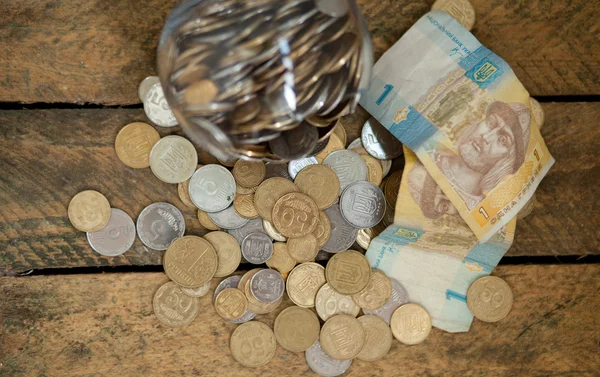 Ukrainian coins and hryvnas shows poverty — Stock Photo, Image