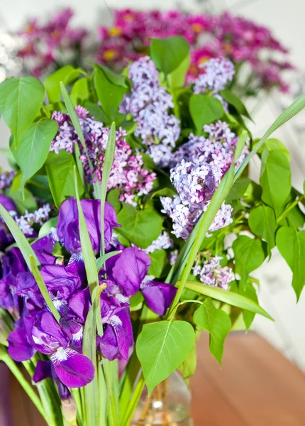 Bouquet of irises and lilac — Stock Photo, Image