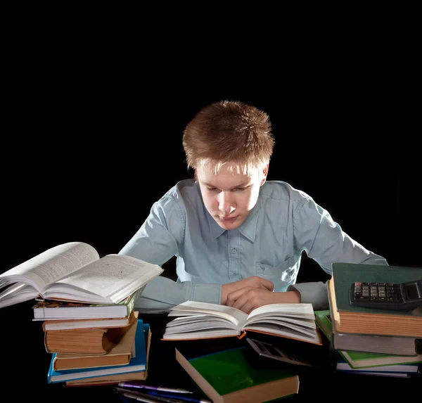 De tiener met een hoop van schoolboeken — Stockfoto