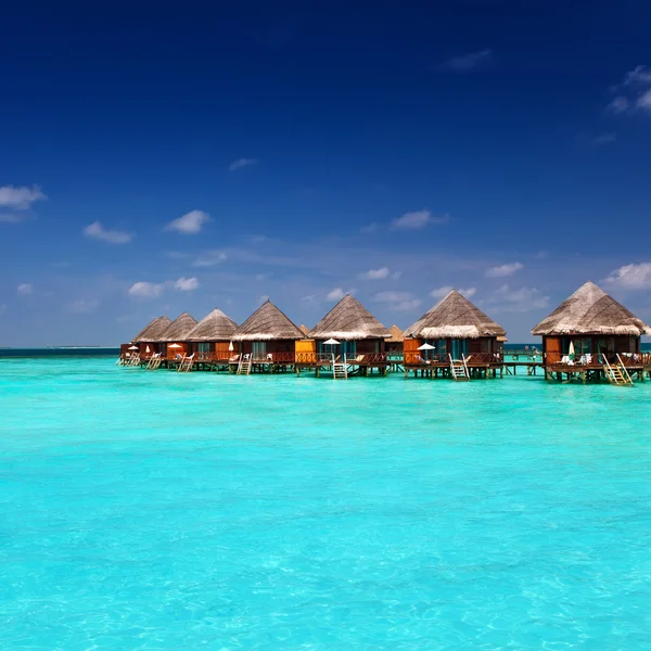 Island in ocean, Maldives.Villa on piles on water