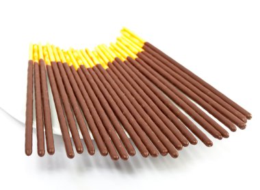 Chocolate sticks on a saucer clipart