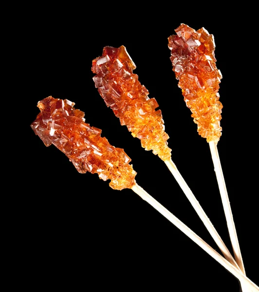 Candy brown sugar on a stick — Stock Photo, Image