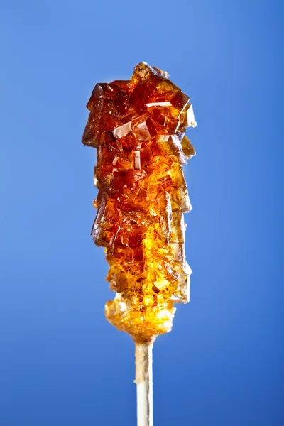 Bonbonbrauner Zucker auf einem Stock — Stockfoto