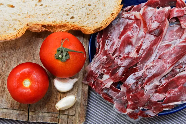 Iberian Ham with tomato bread and Garlic — Stock Photo, Image
