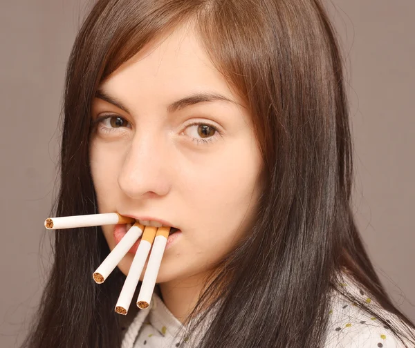 Woman with cigarettes — Stock Photo, Image