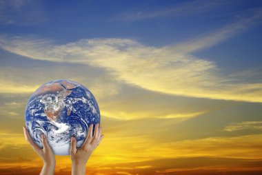 Planet earth in hands.Elements of this image furnished by NASA clipart