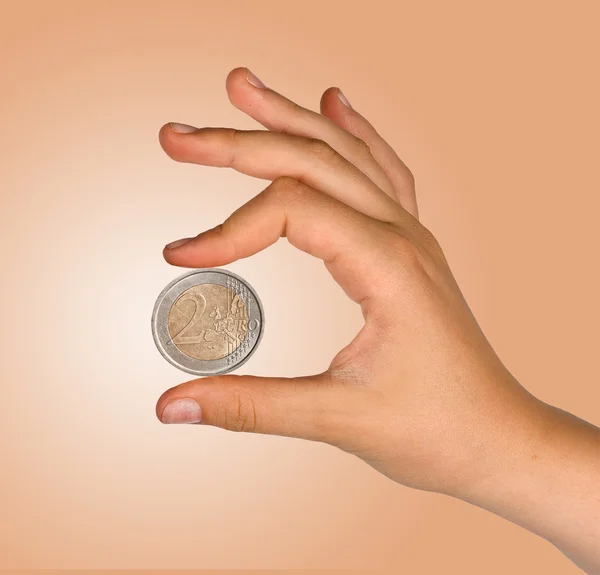 Dos euros en mano aislados sobre fondo blanco — Foto de Stock