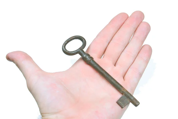 Stary klucz w ręku — Zdjęcie stockowe