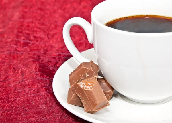 Closeup of coffee and chocolates — Stock Photo, Image