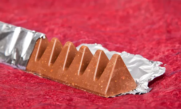 Chocolate in silver wrapper — Stock Photo, Image