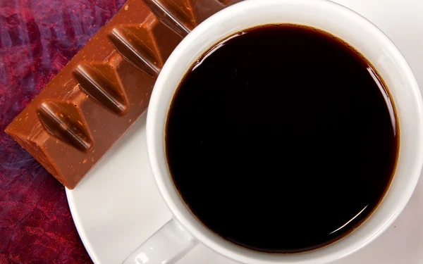 Close-up of coffee and chocolate — Stock Photo, Image