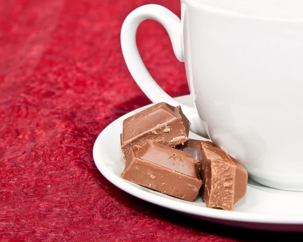 Macro of coffee cup and chocolate blocks — Stock Photo, Image