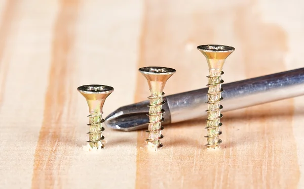 Three screws in a row — Stock Photo, Image