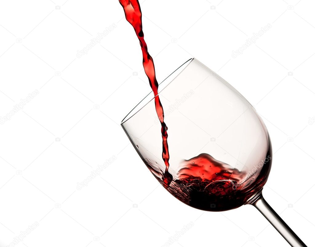 Pouring red wine in wine glass
