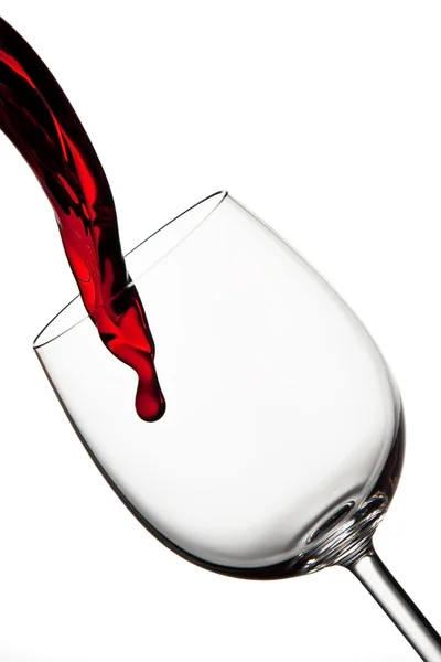 Tasty red wine poured into crystal glass — Stock Photo, Image
