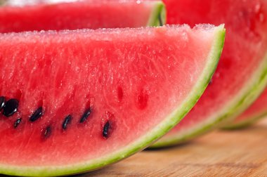 Fresh watermelon on a wood table clipart