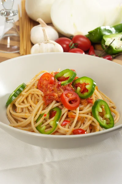 Spicy italian pasta tomato and chili peppers sauce — Stock Photo, Image