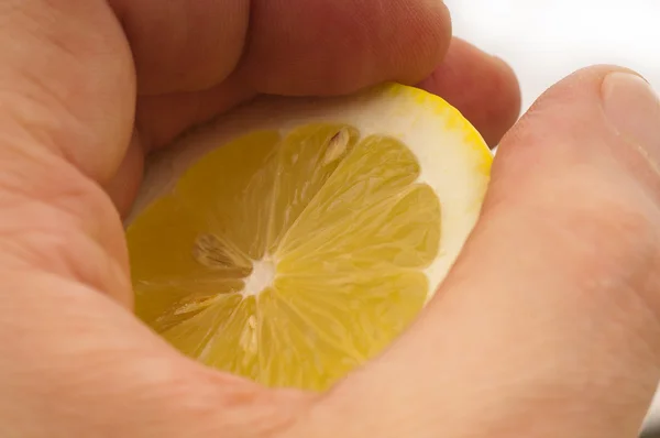 Fresh half lemon on hand — Stock Photo, Image