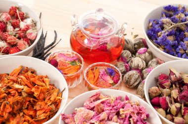 Herbal natural floral tea infusion with dry flowers clipart