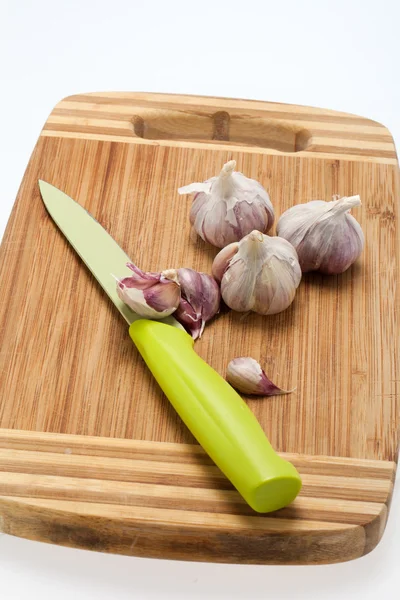 stock image Garlic on the wooden table