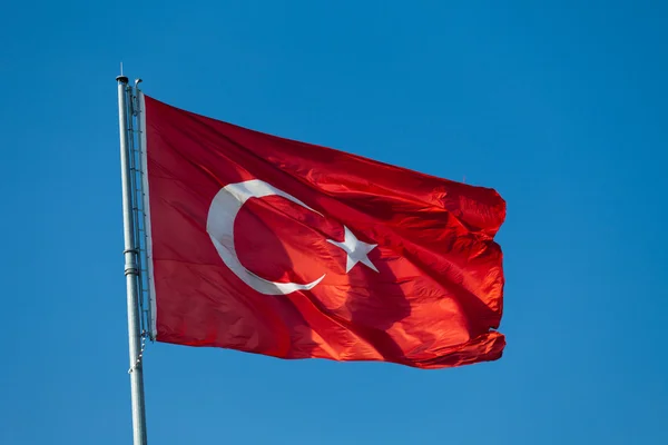 stock image Waving flag of Turkey under blue sky