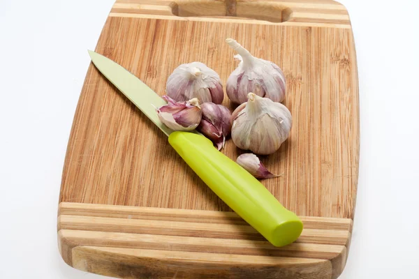 Garlic on the wooden board — Stock Photo, Image