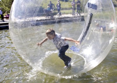 Boy Swim inside pastic bubble clipart