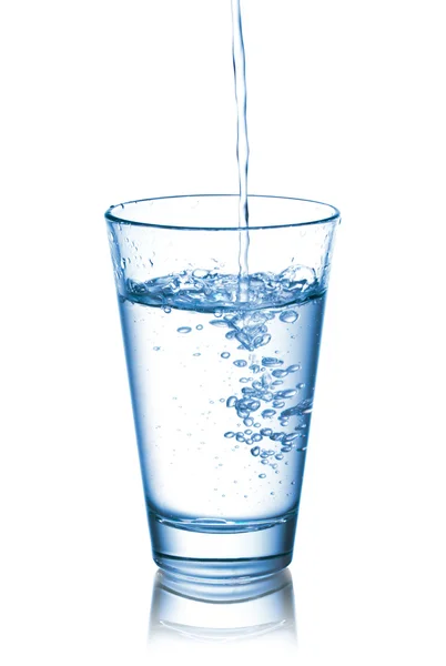 stock image Pouring water into glass