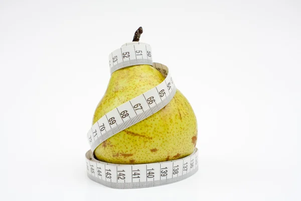 Tape measure wrapped around pear — Stock Photo, Image