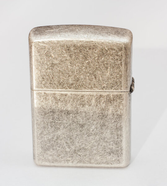 Зажигалка на белом фоне.